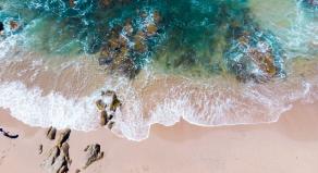Aerial photo of Mazatlan beach Mexico with waves flowing over the shore