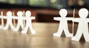 Two paper human chains disconnect or loosing doll in a role of team