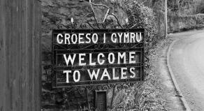 A photograph showing a 'Welcome to Wales' sign