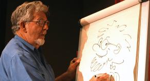 Rolf Harris draws a self portrait cartoon