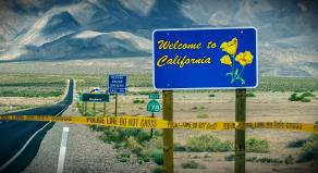 A graphic image showing a 'Welcome to California' sign with police tape digitally added around the signs base
