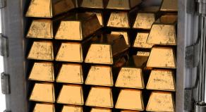 Gold bars stacked up in a safe