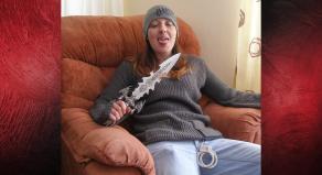 Joanna Dennehy sitting in a chair holding a very large knife