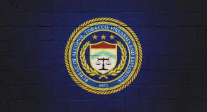 The ATF (Bureau of Alcohol, Tobacco, Firearms and explosives) logo painted on a brick wall.