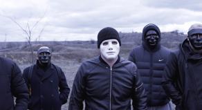 A gang of men wearing masks