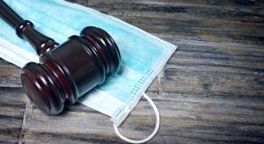 A gavel on a surgical face mask