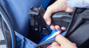 Taking a gun out of a child's backpack