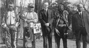 Four Osage men with U.S president Calvin Coolidge