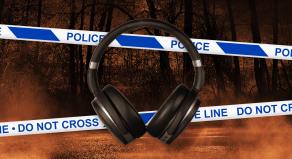 Headphones and police crime scene tape with a spooky forest background
