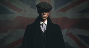 1920s English gangster in a flat cap