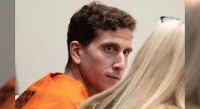 Bryan Kohberger looks toward his attorney during a hearing