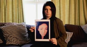 Alice holding a picture of her murdered cousin, Lea Ware