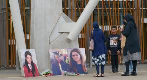 People participate in a vigil at the Scottish Parliament for Fawziyah Javed