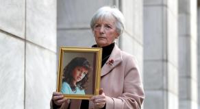 Marie McCourt holds a picture of her daughter Helen