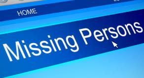 A cursor hovering over a 'Missing Persons' banner on a web page