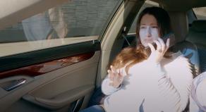 Gypsy Rose Blanchard using her mobile phone while in the passenger seat of a car