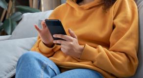 A woman scrolling on her smartphone