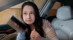 Gypsy Rose Blanchard using her phone on loudspeaker while sitting in the passenger seat of a car