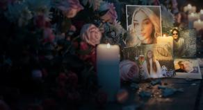 Flowers and candles are laid at a tribute to innocent people who have died