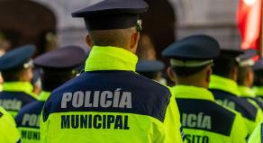 Back view of the municipal police of Puebla with the "Policia Municipal" logo emblem on uniform