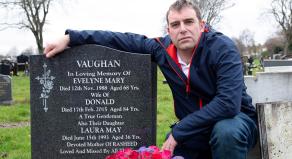 Laura May Al-Shatanawi's son, Rasheed Vaughan, with her gravestone that she shares with her parents