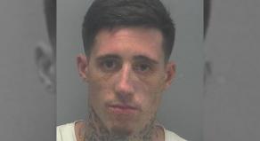 Wade Wilson police mugshot before his excessive facial tattoos