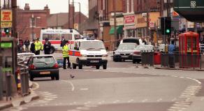 Police inspect an explosion on Eltham High Street that they believe was set off by the Mardi Gra Bomber