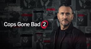 'Cops Gone Bad 2' - Will Mellor standing in front of 'Wanted' posters
