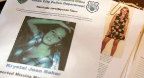 A missing poster for Krystal Jean Baker lies on top of her case file