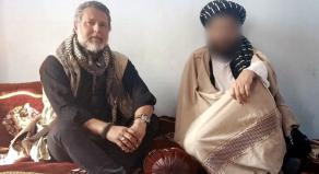 Ian Purchase photographed meeting a member of the Taliban