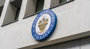 External signage of the West Midlands Police crest outside of Police Headquarters at Lloyd House, Birmingham