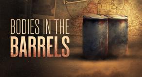'BODIES IN THE BARRELS' - Two large dirty oil barrels in front of an atlas map of Australia