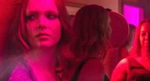 Women under pink lights in a reconstruction