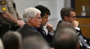 Thomas Martens sitting with his attorneys in court