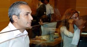 Suspect Mohammed M'Barek and his sister Jamila stand at the start of his trial in a Nice courthouse