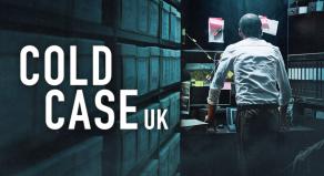 'COLD CASE UK' - A detective standing in an evidence room surrounded by boxes of evidences and facing away from the camera to look at evidence stuck to the wall