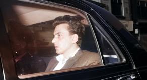 Colourised image of Ian Brady in the back of a police car