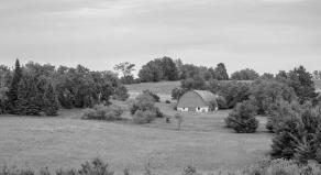 Black and white photograph of rural farmland in Wisconsin