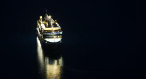 A cruise ship sailing at night