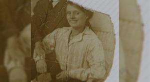 Black and white torn photograph of Louisa Dunne when she was believed to be in her late twenties