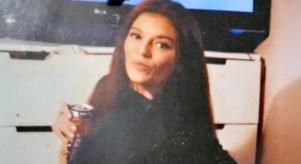 Sarah Henshaw posing in a personal photo with a can in her hand