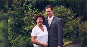 Brian Blackwell posing for a family photograph with his mother