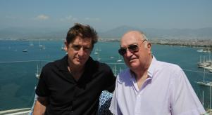 Marcel Theroux and Keith Cheeseman on a balcony overlooking the sea