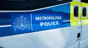 A Transit van with 'Metropolitan Police' branding on the side