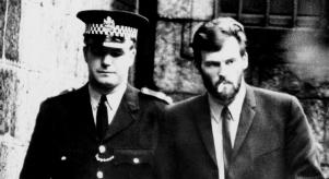 Brian Tevendale walking with a policeman