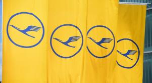The Lufthansa logo on a series of yellow flags