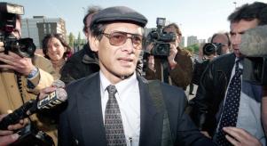 Charles Sobhraj surrounded by press as he leaves court