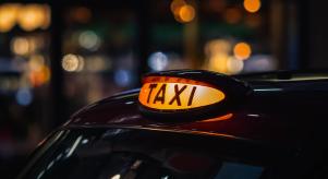 The light on top of a London taxi at night