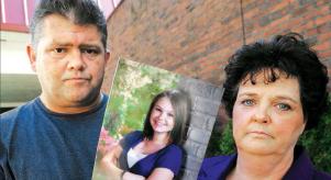 Dave and Mary Neese holding a photograph of their missing daughter, Skylar