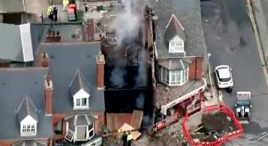Aerial image of a terraced housing following an explosion in one of them